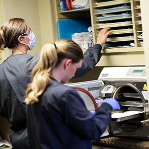 Two hygienists work in a dental lab